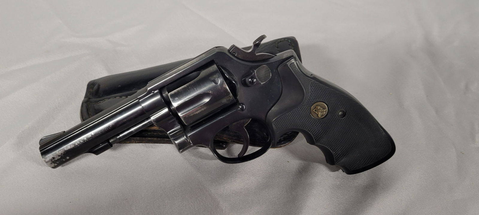 Smith & Wesson Model 10-6 38Spl Revolver, 4" Barrel,: Smith & Wesson Model 10-6 38Spl Revolver, 4" Barrel, Leather Holster, Pachmayr Grips, Some Holster wear. JH TP C696215