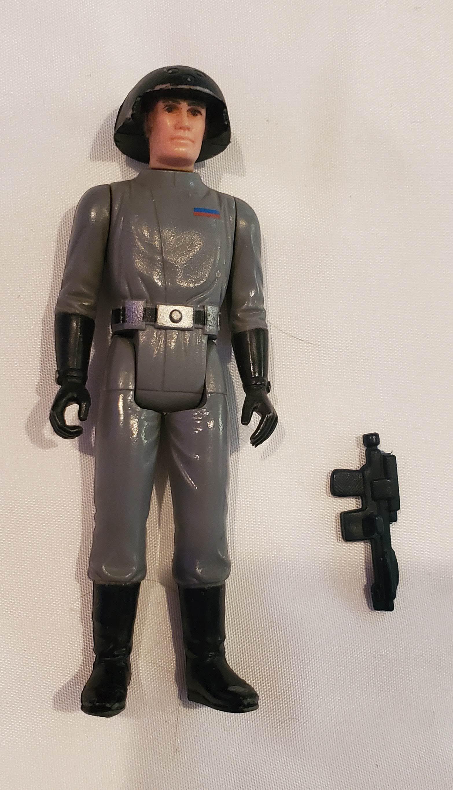 Vintage Star Wars ANH Death Star Squad Commander: This figure is complete with gun. Please read carefully. Description given are based on opinion unless otherwise documented. We ask that you look at pictures carefully before bidding. We are more than