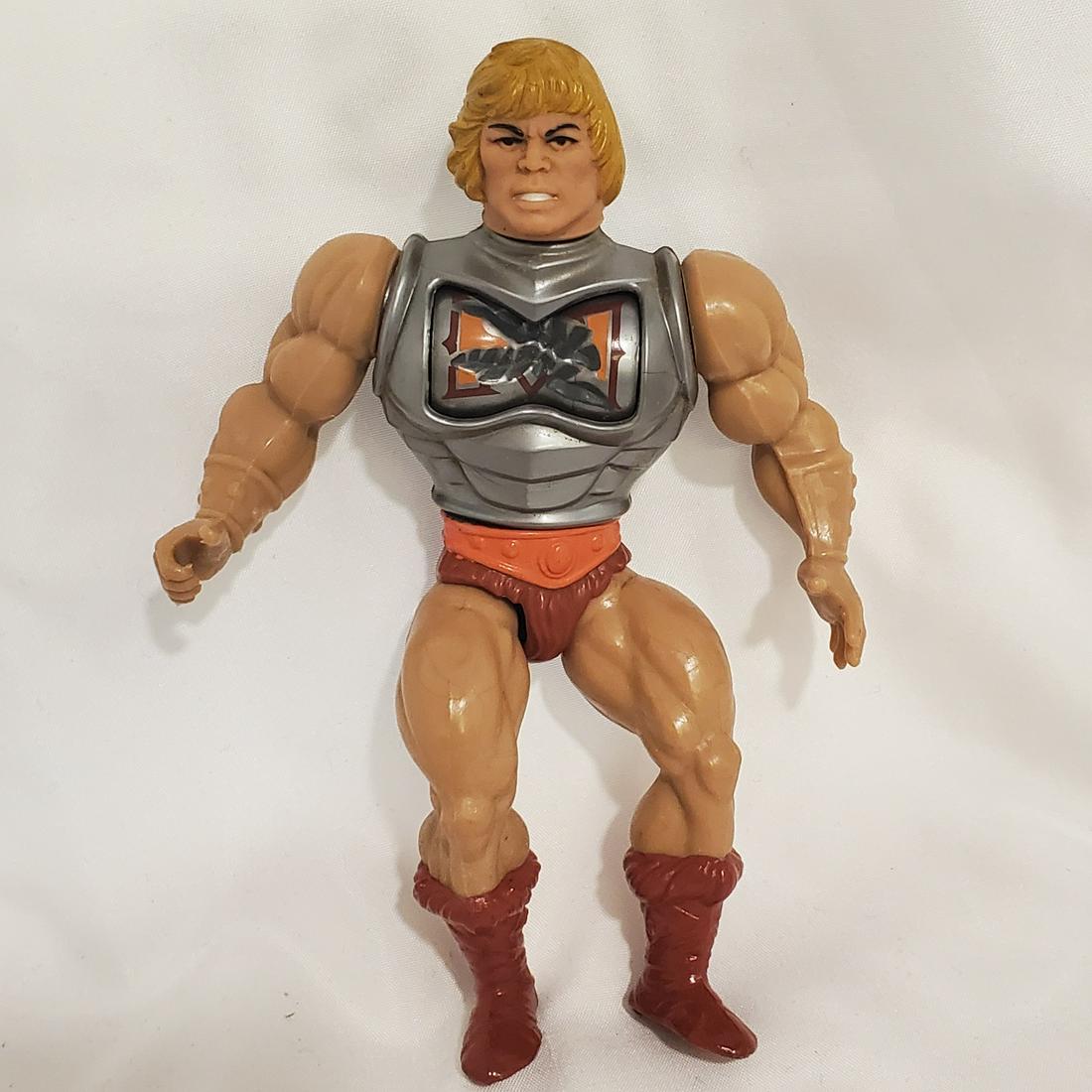 Vintage 1980's He-Man MOTU Battle Armor He-Man Action Figure: Please read carefully. Description given is based on opinion unless otherwise documented. We ask that you look at pictures carefully before bidding. We are more than happy to take more pictures or ans