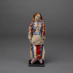 A Male Plains beaded hide doll