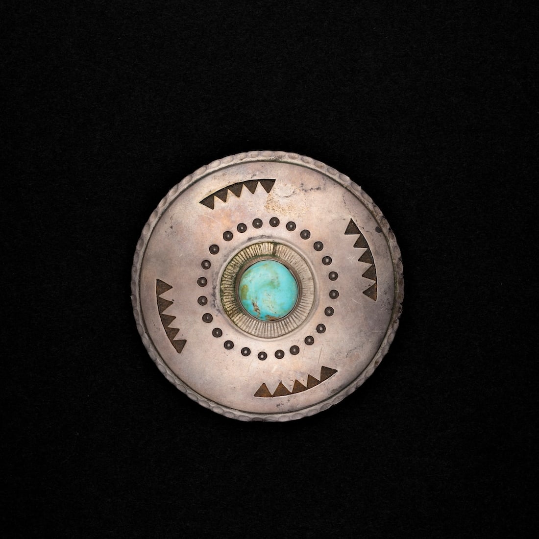An Philip Haozous silver and turquoise belt buckle: Philip Haozous, Chiricahua Apache (b. 1941). The son of Allan Capron Houser or Haozous (June 30, 1914 – August 22, 1994). Marked “Haozous ’74.” Dia. 2 6/8 in.