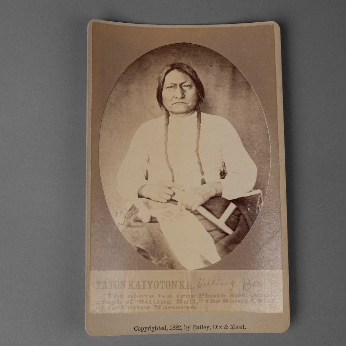 A cabinet card Photograph of Sitting Bull: Albumen print by Bailly, Dix and Mead, Fort Randall, Dakota Territory, 1882. Size of photo 6 x 4, size of card 6 1/2 x 4 in.