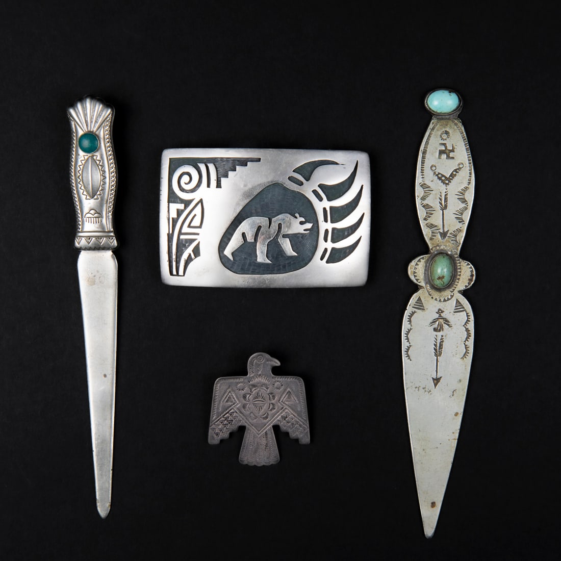 Two letter openers, a buckle and pin (1 of 2)