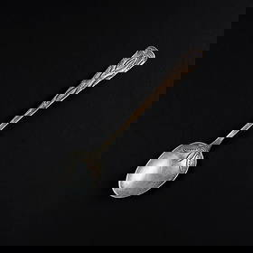 A large Navajo (Diné) silver spoon: A silver spoon with stamp work decoration on the handle and scoop. Lg. 7 in. Gross weight approximately 40g.