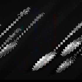 Four Navajo (Diné) silver spoons: Four silver spoons, one with turquoise setting on the handle, each with stamp decoration. Lg. 5 ¼, 5, 4 ¾, and 4 ¾ in. Gross weight approximately 52g.