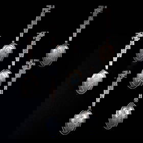 Six Navajo (Diné) silver spoons: Six silver spoons each decorated with stamp work including crosses arrows and whirling logs, each with whirling log finial. Lg. 5 ½, and 4 ¾ in. Gross weight approximately 80g.