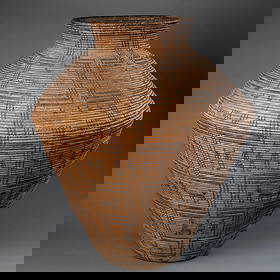 A large Western Apache polychrome pictorial olla: Designed with interlocking geometric rectangles enclosing various animal and human figures, minor stitch loss and a lean at the bottom. Ht. 29, wd. 22 ½ in.Provenance: Private collection, Penns