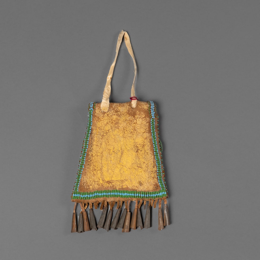 An Apache beaded hide pouch - 2