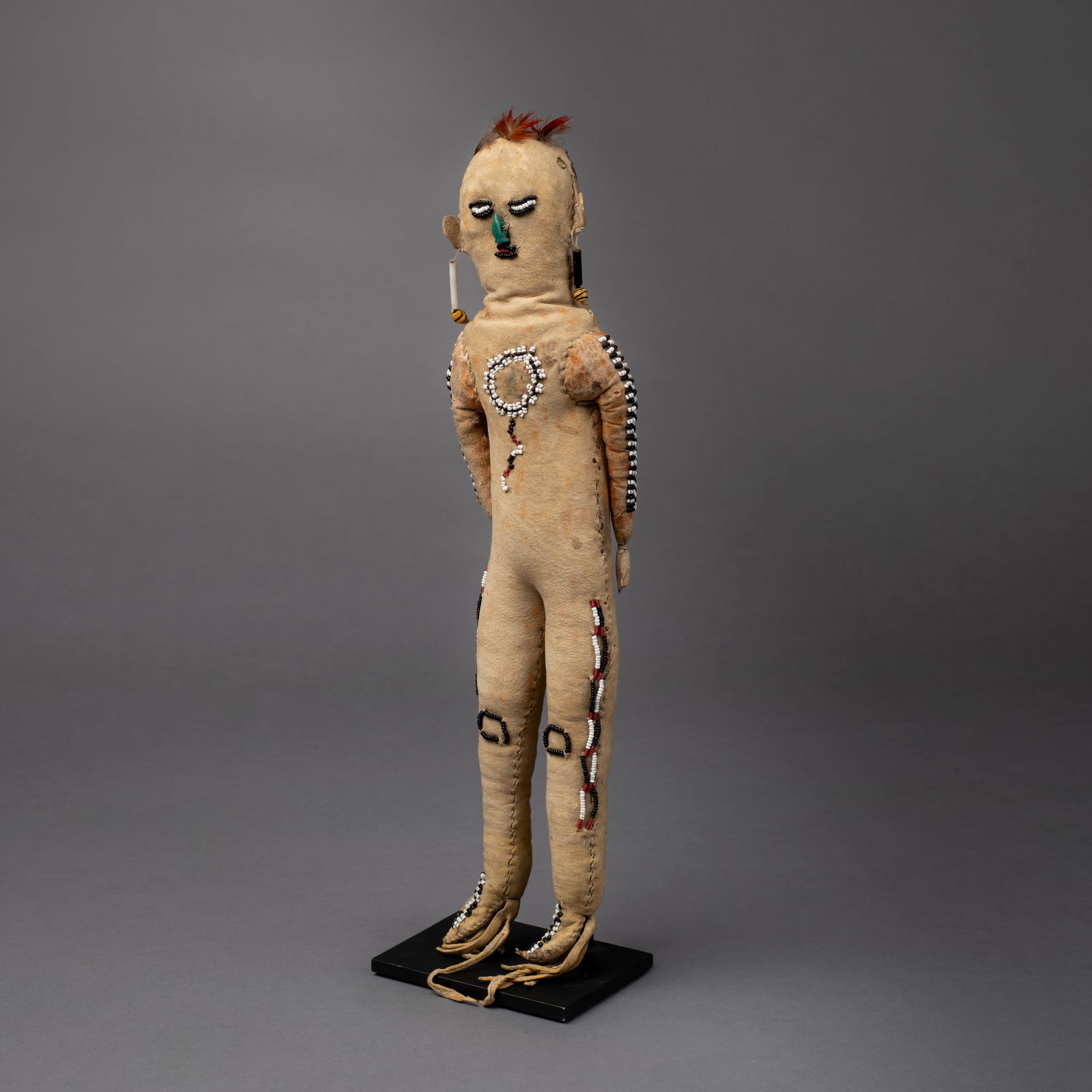 An Apache beaded hide doll - 2