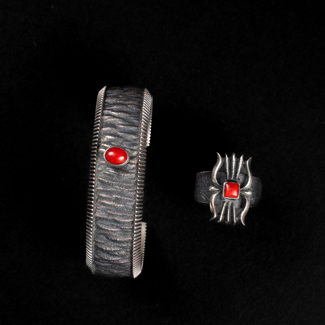 An Aaron Anderson bracelet and ring: The silver cast bracelet with single coral setting, signed "Aaron A," with a cast ring with coral setting, signed "Aaron A." Total interior circumference (including gap) 6 1/2, wd. 3/4, gap 1 in. Ring