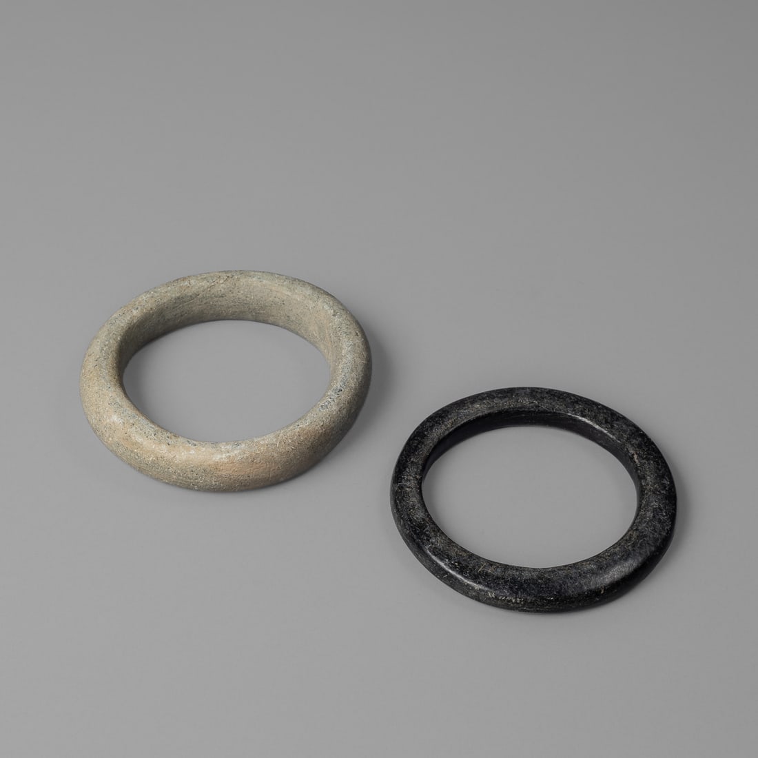 Two Tuareg bracelets: Sahelian Region, Mali, Niger, Burkina Faso, late 19th/early 20th century. Exterior dia. 4 ¼, wd. ¾, exterior dia. 4 ¼, wd. 3/8 in. Provenance: The Tom Joyce Collection, Santa Fe,