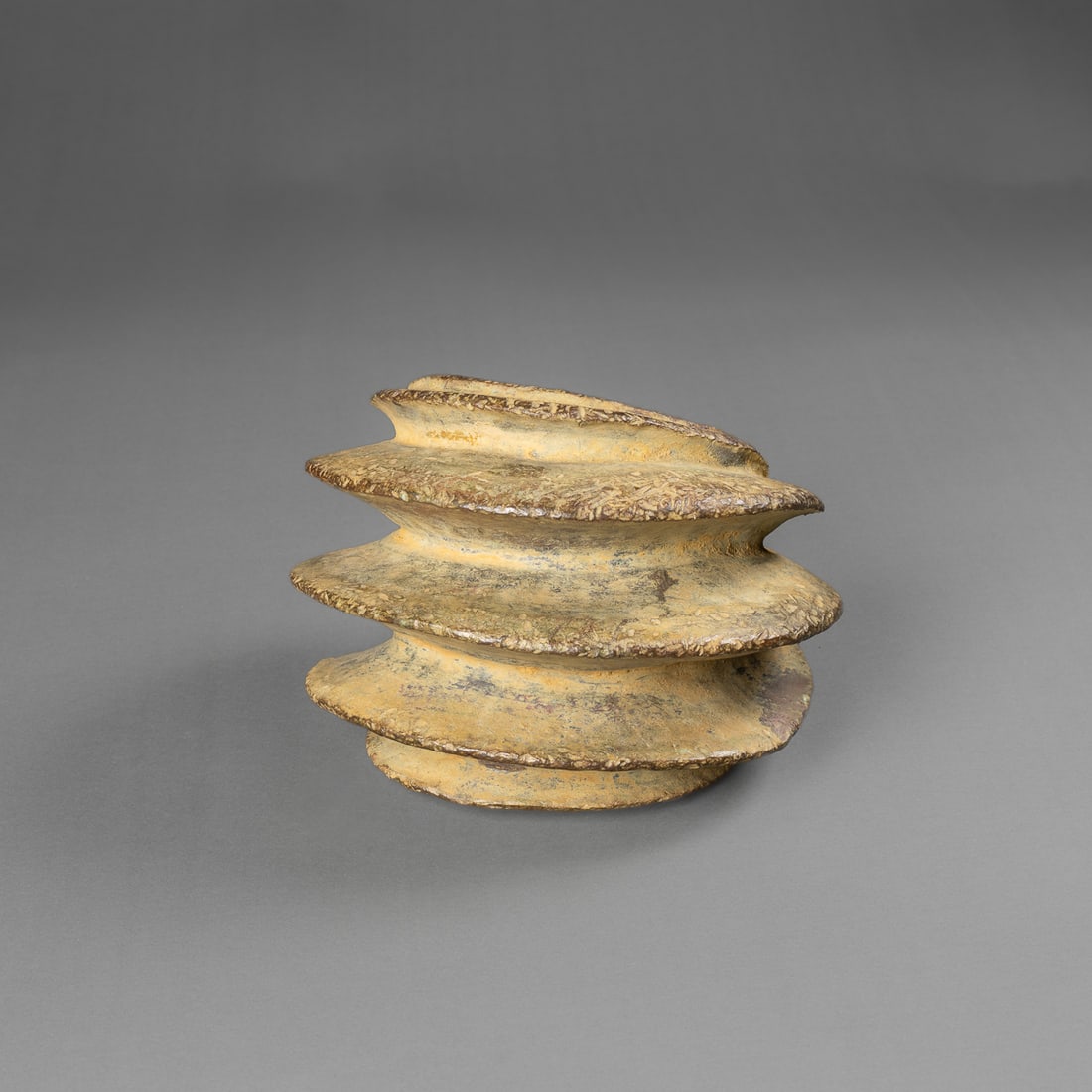 A Kota anklet: Gabon, 18th/19th century, Kota people’s anklet, cast and forged in copper alloy, the heavy anklet with three high ridges. Lg. 6 ¾, wd. 4 ¾ in. Provenance: The Tom Joyce Collection,