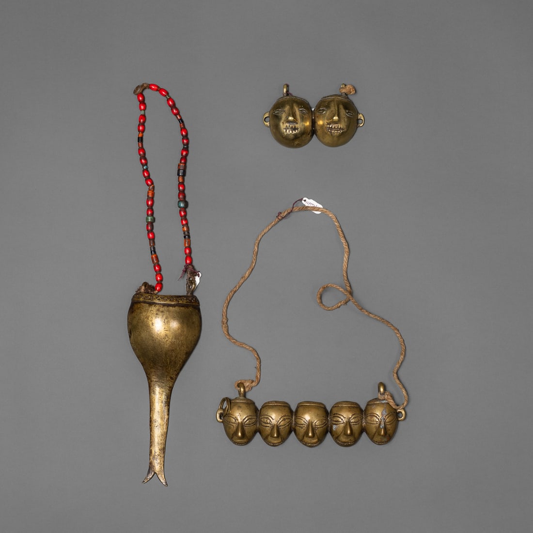 Three brass Naga chest ornaments (1 of 2)