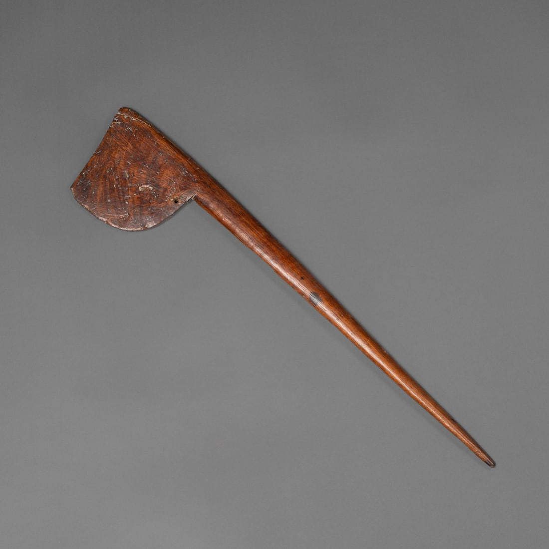 A Maori child's staff, tewhatewha: 19th century, this small example probably for an adolescent, pierced on underside of blade for attachment of feathers, minor wood loss, lg. 18 in. Provenance: Private collection, Los Angeles, CA; Davi