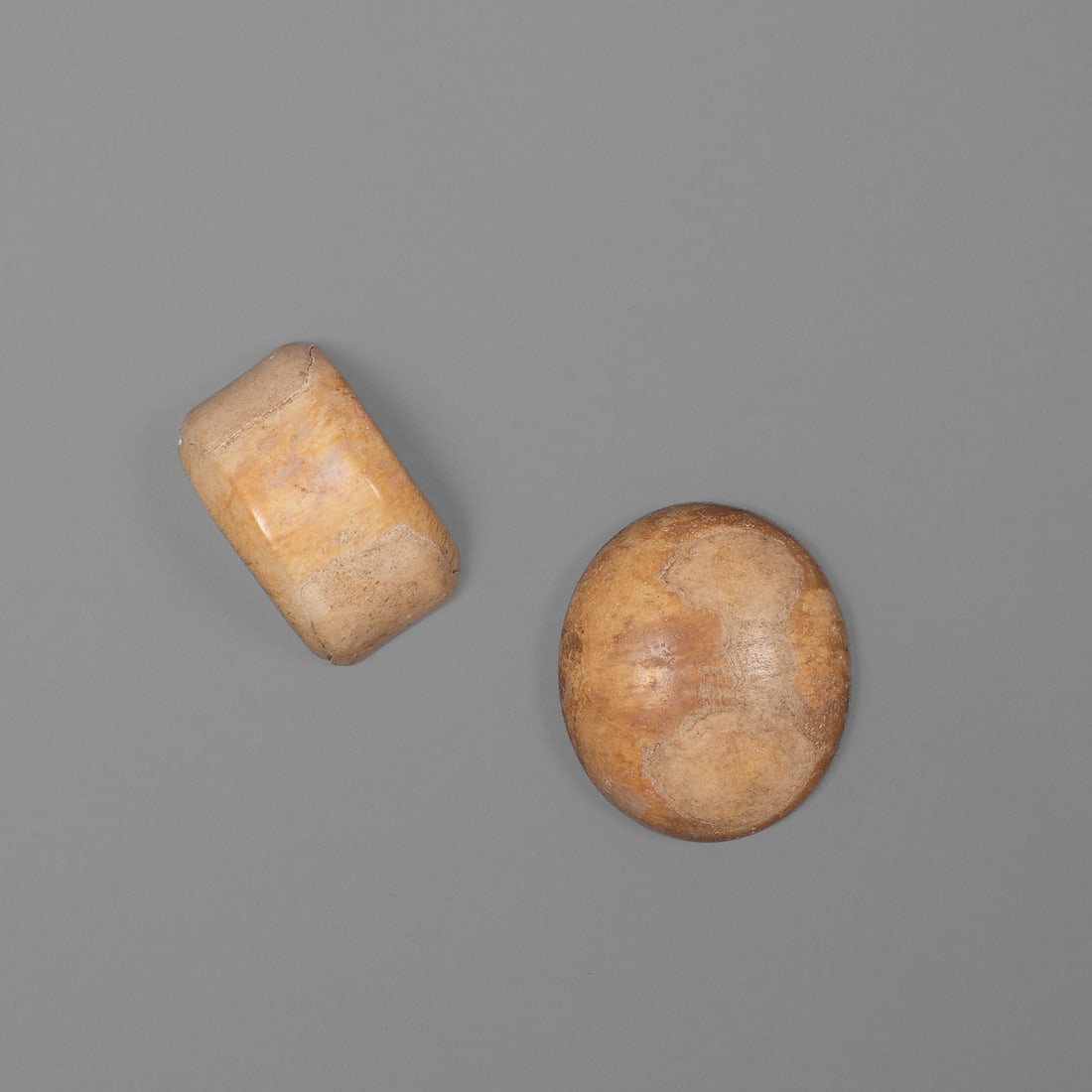 Two early Hawaiian wrist ornaments, kupe’e palaoa: Circa 1800, or earlier, kupe’e palaoa, these bracelets were originally strung with plated ‘olona fiber, and later with imported silk ribbon after arrival of missionaries. The larger pierced with