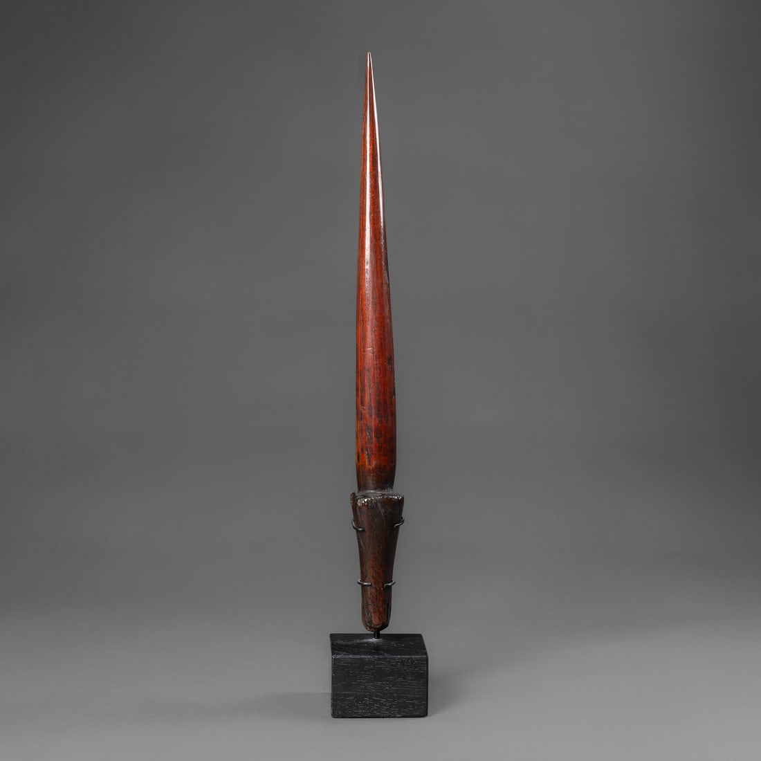 A Hawaiian wood dagger, pahoa: Late 18th, early 19th century, originally cut from a lance, then formed into a dagger, probably carved from the dense Kauila wood, rich smooth dark brown patina, the long-rounded dagger with sharp poi