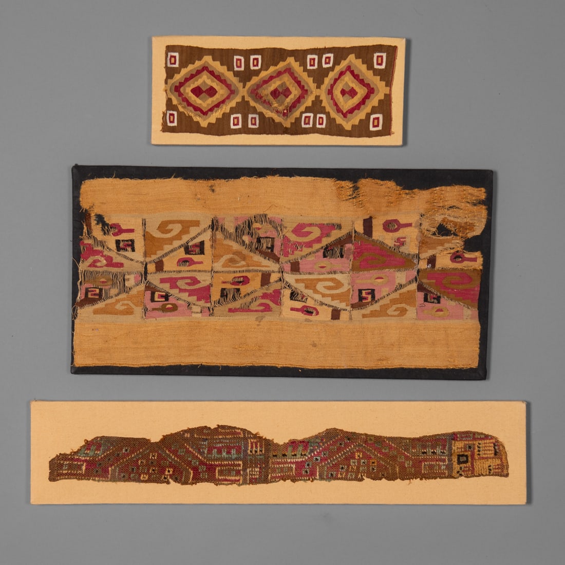 Three mounted Latin American textiles (1 of 4)