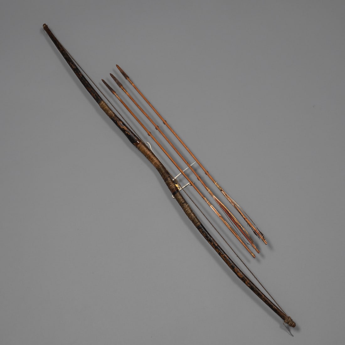 A Ute bow with three arrows (1 of 4)