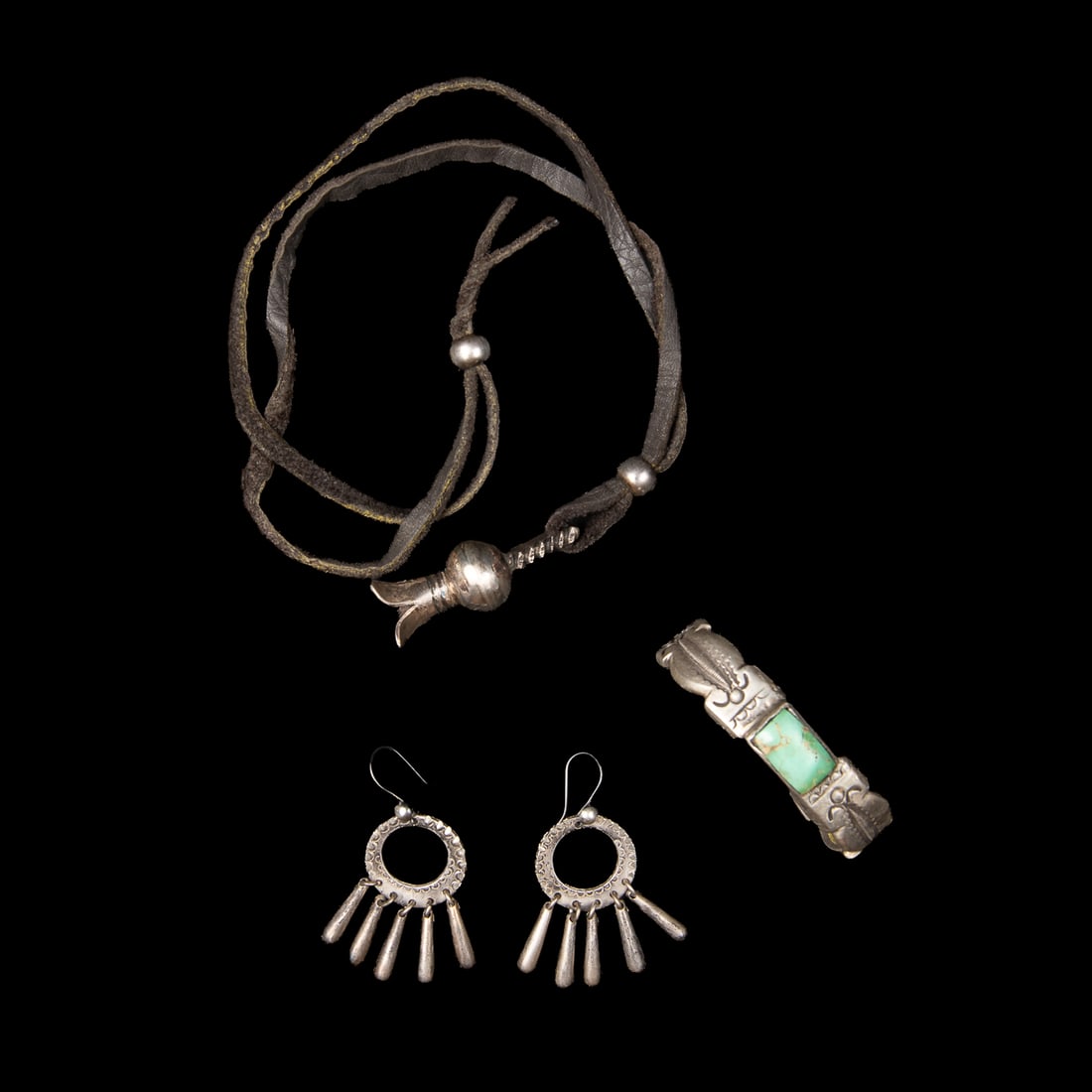 Three Navajo-Style Silver Jewelry Pieces by Jock Favour: Lot of three, (1) Hand-forged coin silver cuff featuring a large rectangular natural turquoise stone in a simple bezel setting, flanked by hand-stamped and repoussé silver work with scalloped and flo