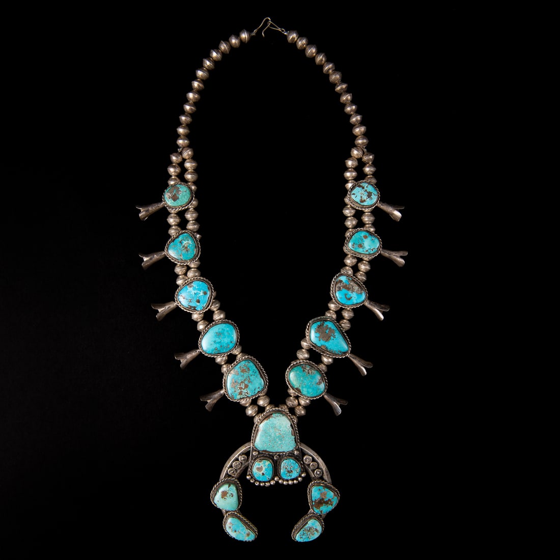 A Navajo silver and turquoise squash blossom necklace (1 of 2)