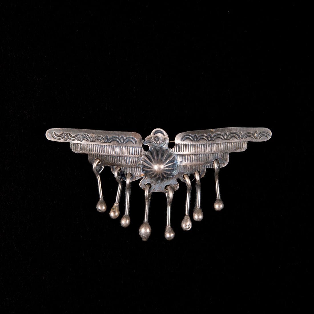A Navajo silver Thunderbird pin (1 of 2)