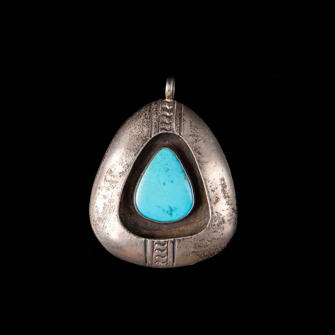 A Hopi silver and turquoise pendant (1 of 2)