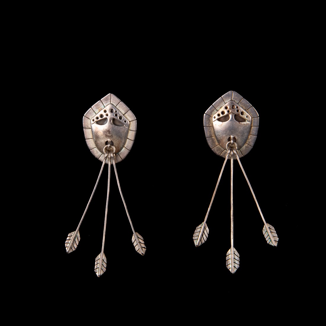 A pair of Denise Wallace earrings: Denise Wallace (Native American, Sugpiaq, B. 1957) Sterling Silver Earrings, 1992, each bearing silver hallmarks, date, and artist's signature on the backsides. Ht. 2 ¾, wd. ¾ in. Gross
