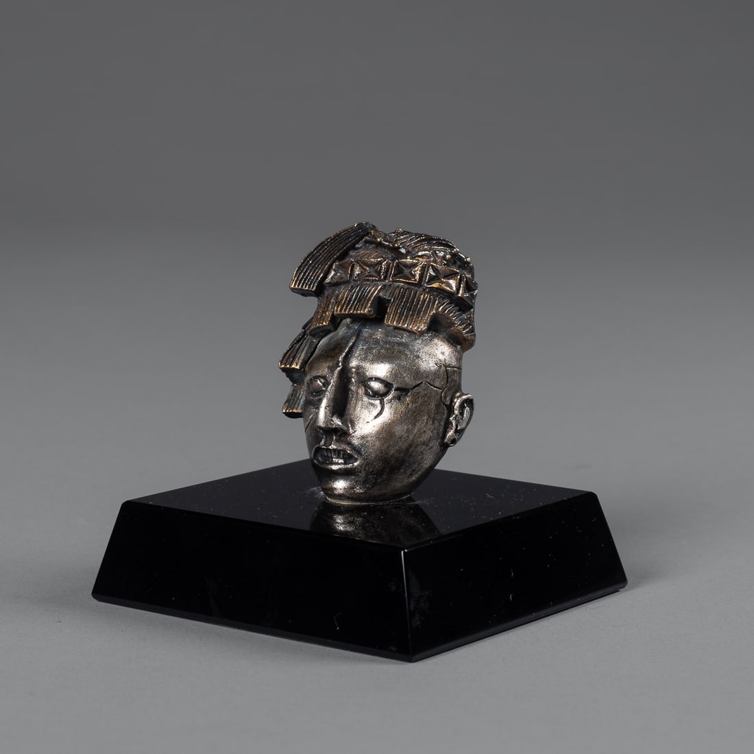 A Tane silver head - 2