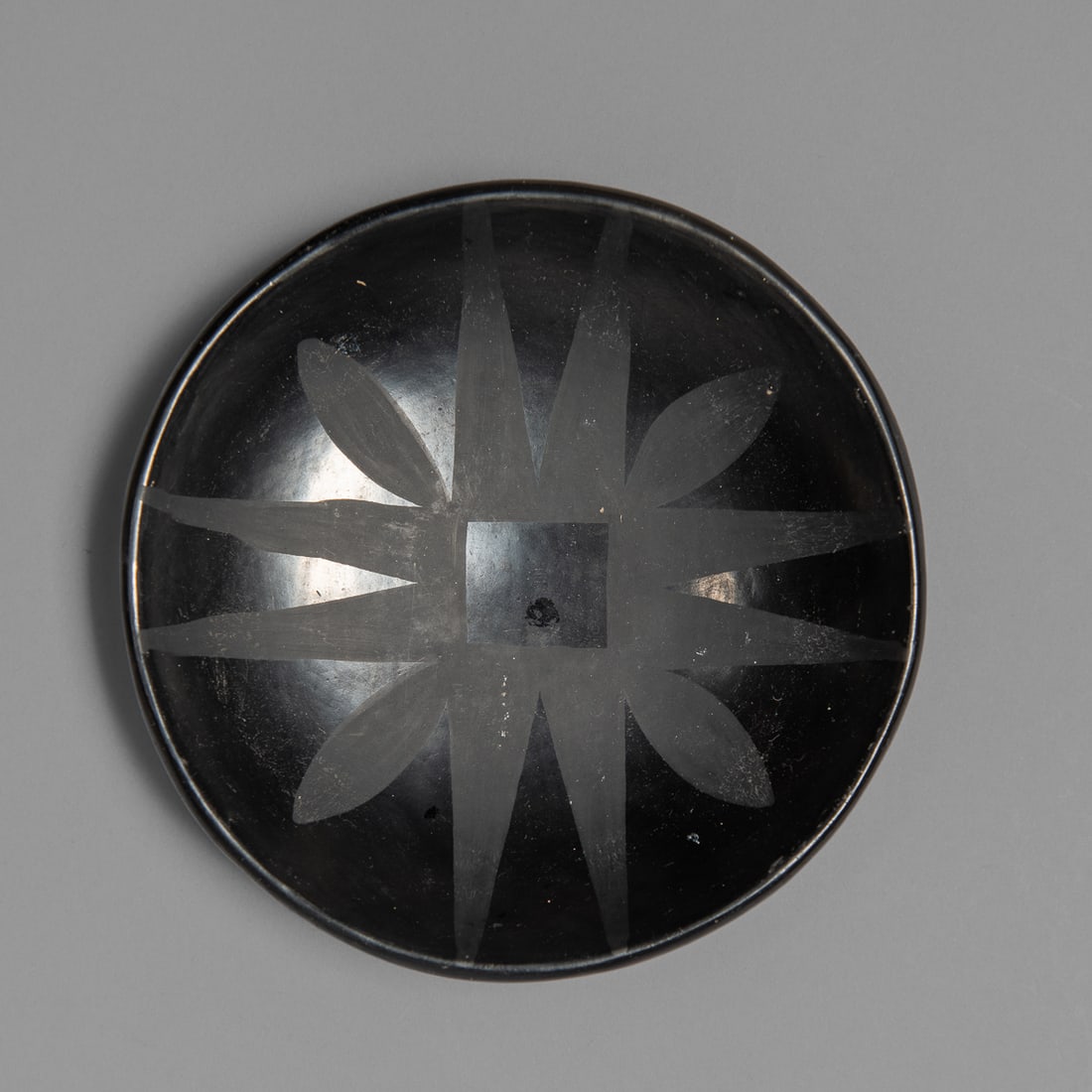 A Marie and Julian blackware plate (1 of 3)