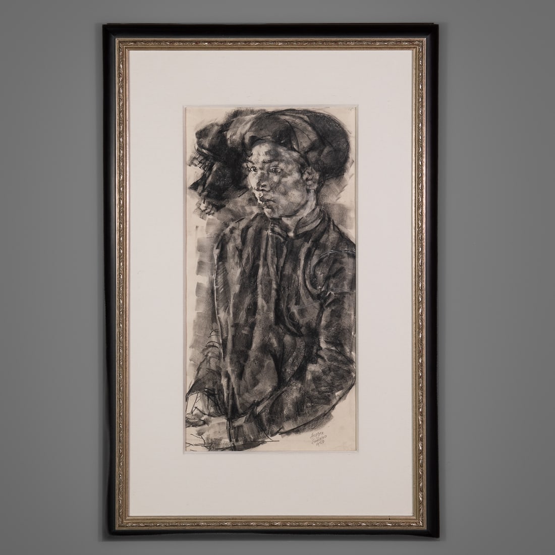A Roland Strasser charcoal: Roland Strasser (Austrian, 1895-1974), portrait of a Sumatran, charcoal on paper, signed “Strasser Sumatra 1924.” Framed. Size of drawing 23 ½ x 11 ½, size of frame 34 x 22 &frac