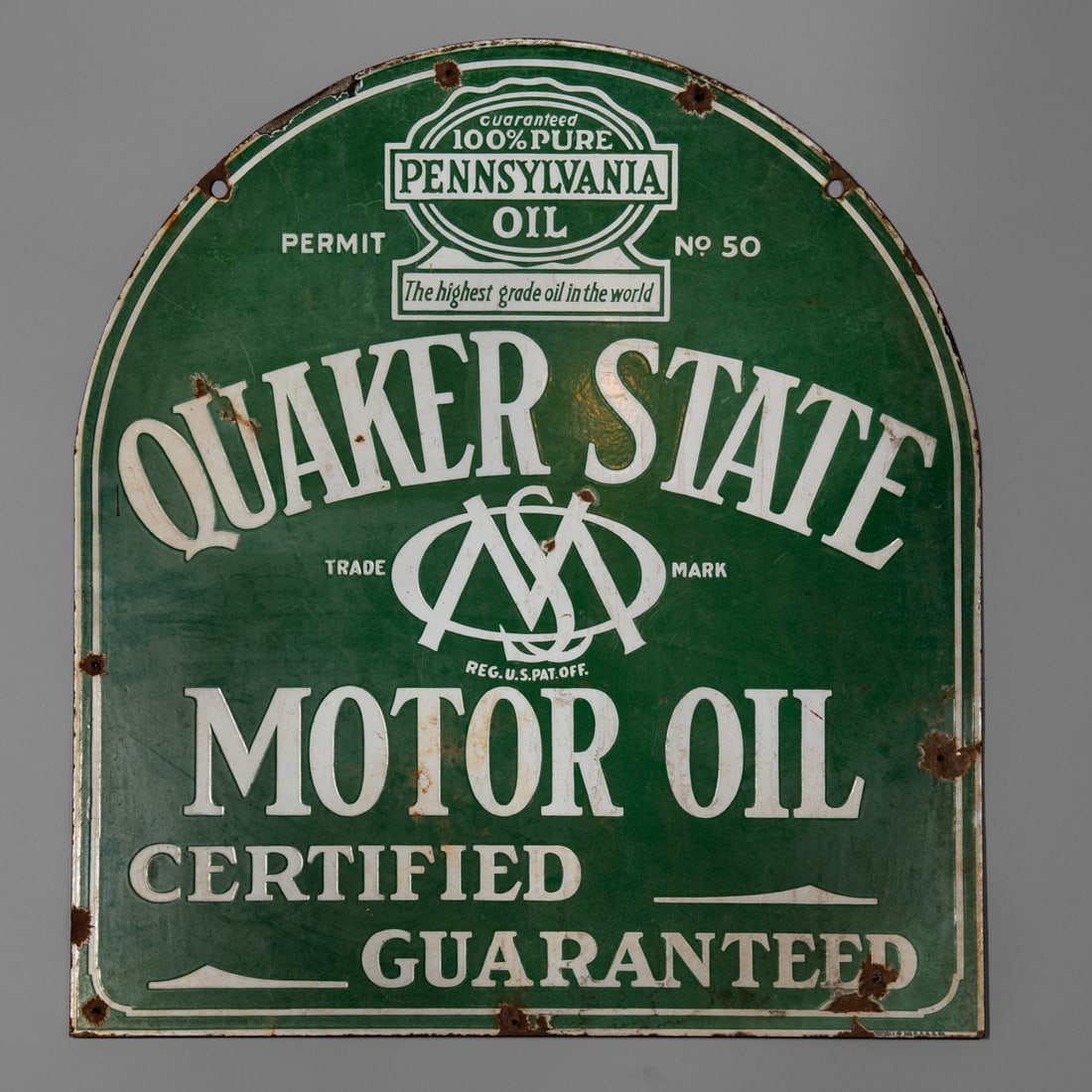 A Quaker state enamel sign: The heavy metal enamel painted sign, pierced at the top for suspension, (minor paint loss). Size 29 1/2 x 26 1/2 in. Provenance: The Tom Joyce Collection, Santa Fe, NM.