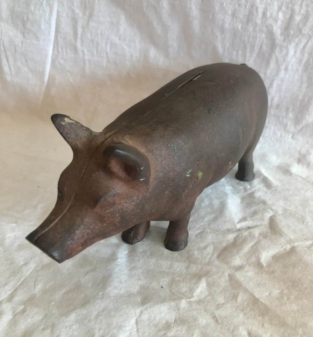 Cast Iron Pig Bank: Early Cast Iron Pig bank. Good overall condition. See pictures for condition. If bidding online feel free to contact us for more information. 3" tall