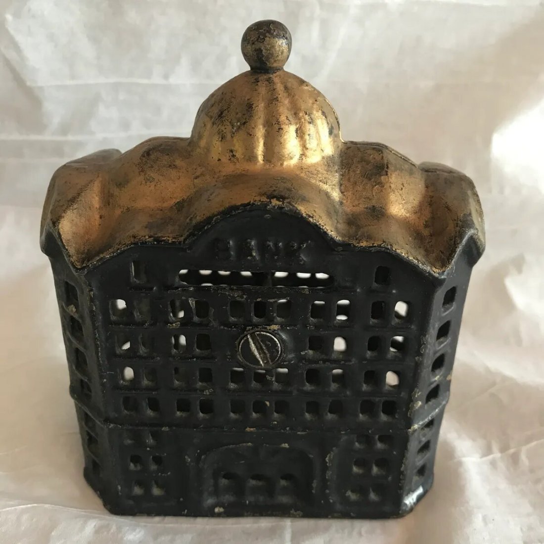 Antique Cast Iron Still Bank of Bank Gold Roof Top: Antique Cast Iron Still Bank of Bank Gold Roof Top. Bank is in good condition retaining most of the gold paint. See pictures for condition. If bidding online feel free to contact us for more informati