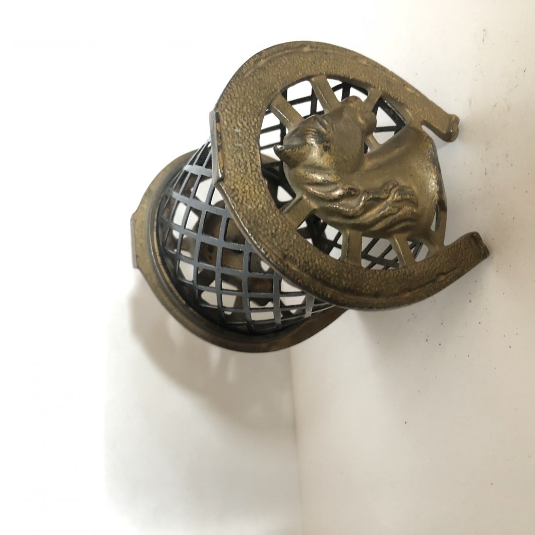 Cast Iron Bank Horse Inside Horseshoe: Antique cast iron still bank featuring horse in horseshoe with wire mesh mage by Arcade. 4" tall. Very nice original condition. No visible cracks. See pictures for condition. If bidding online feel fr