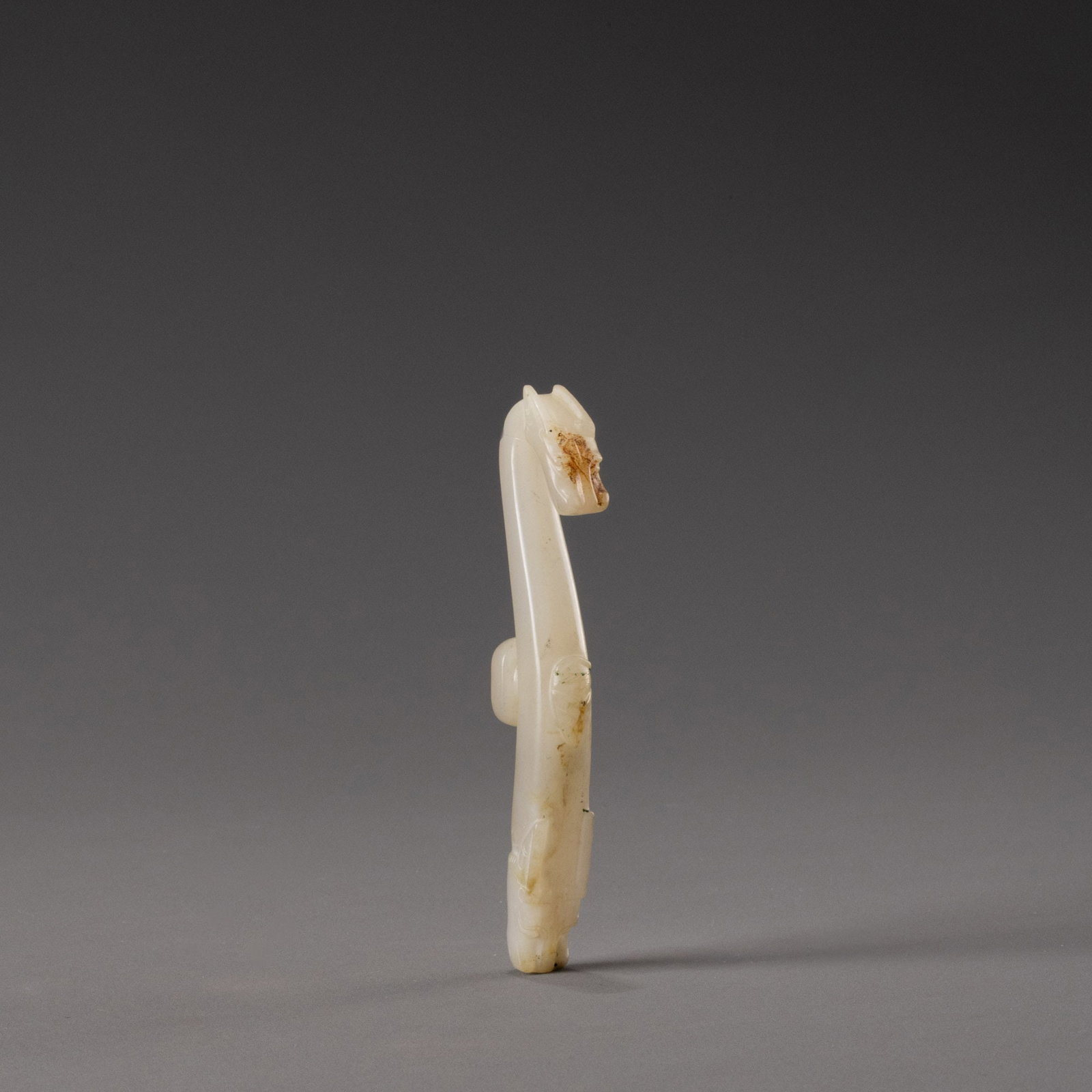 White jade carving of a dragon with hook (1 of 10)