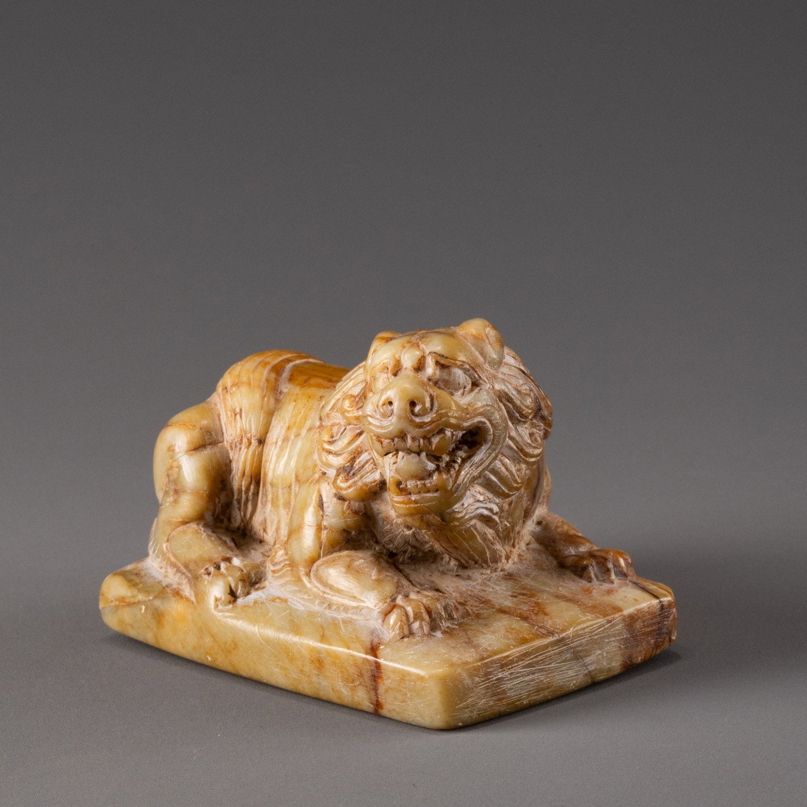 Tang Dynasty Stone Carved Reclining Lion: W:10cm H:7cm