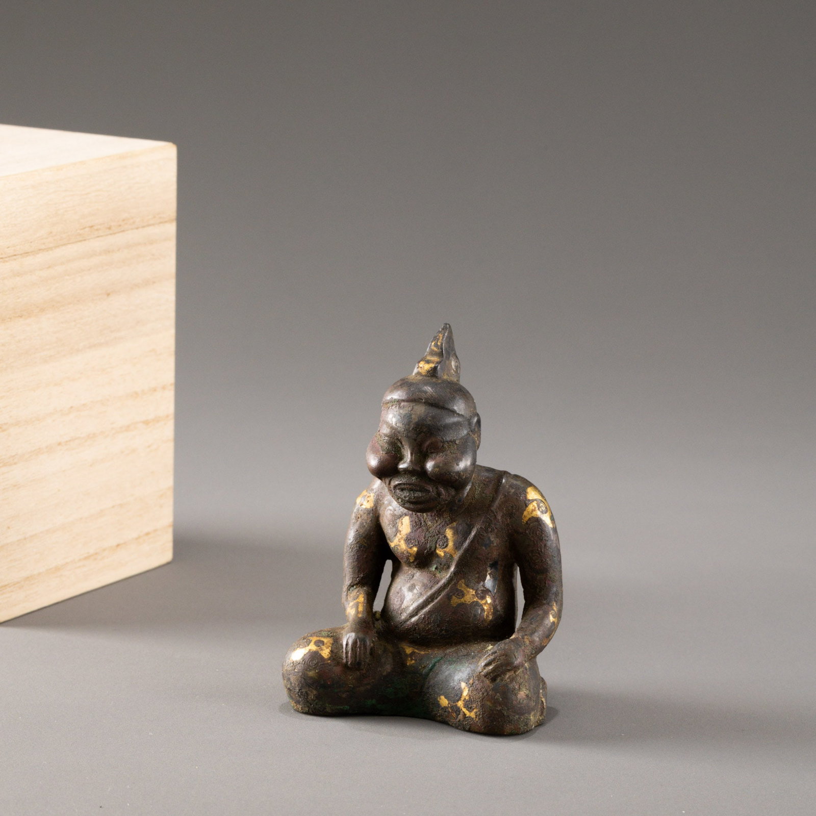 Bronze and gold inlaid seated figure: H: 10cm W: 7cm
