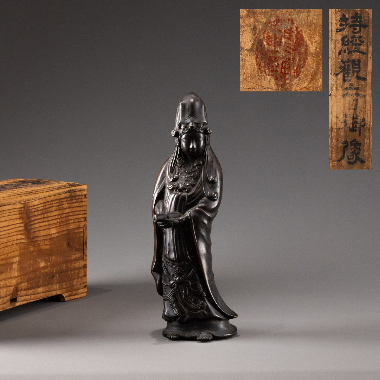 Ancient bronze statue of Guanyin holding a sutra: H: 32cm W: 10cm