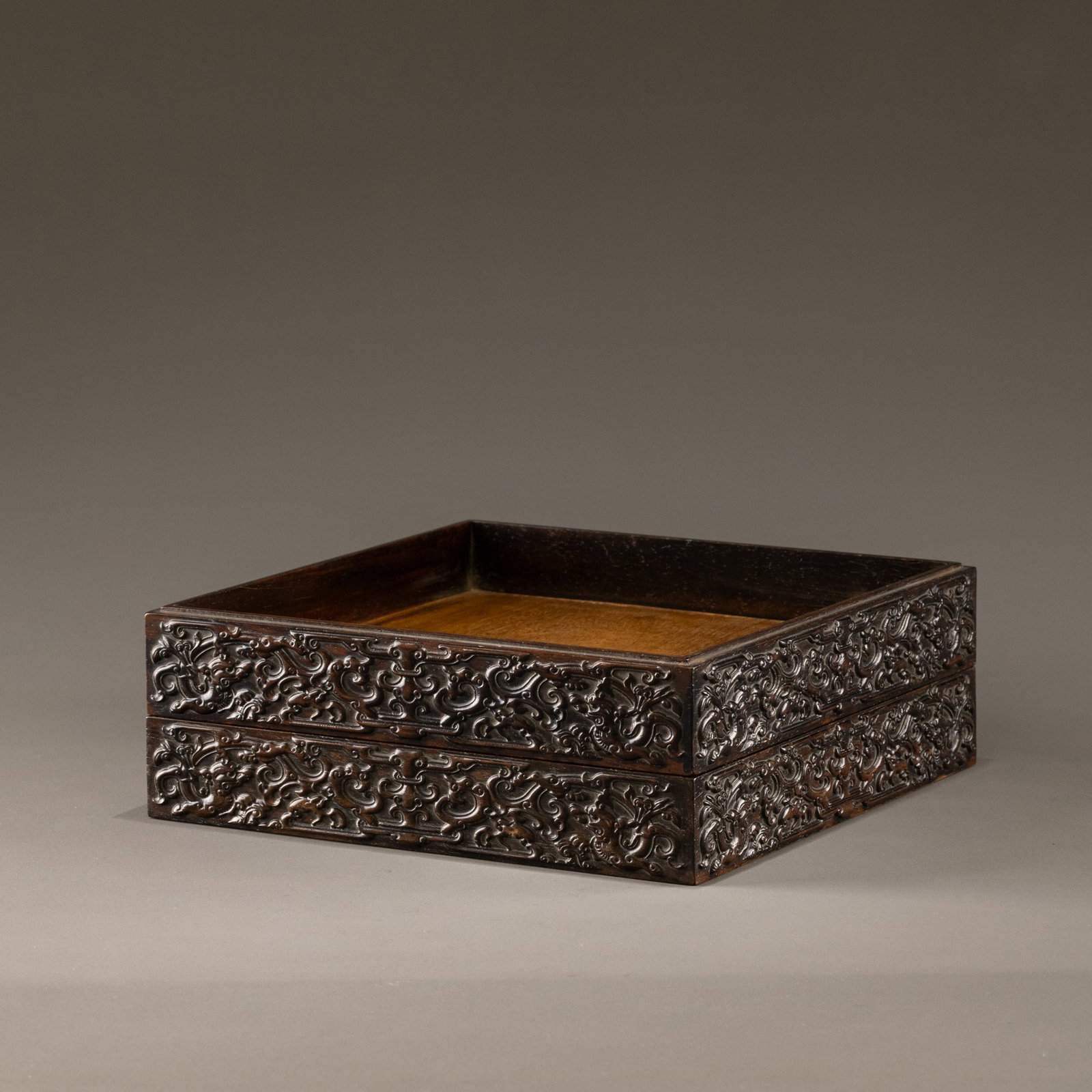 A pair of square wooden trays with carved cloud and dragon patterns. (1 of 7)