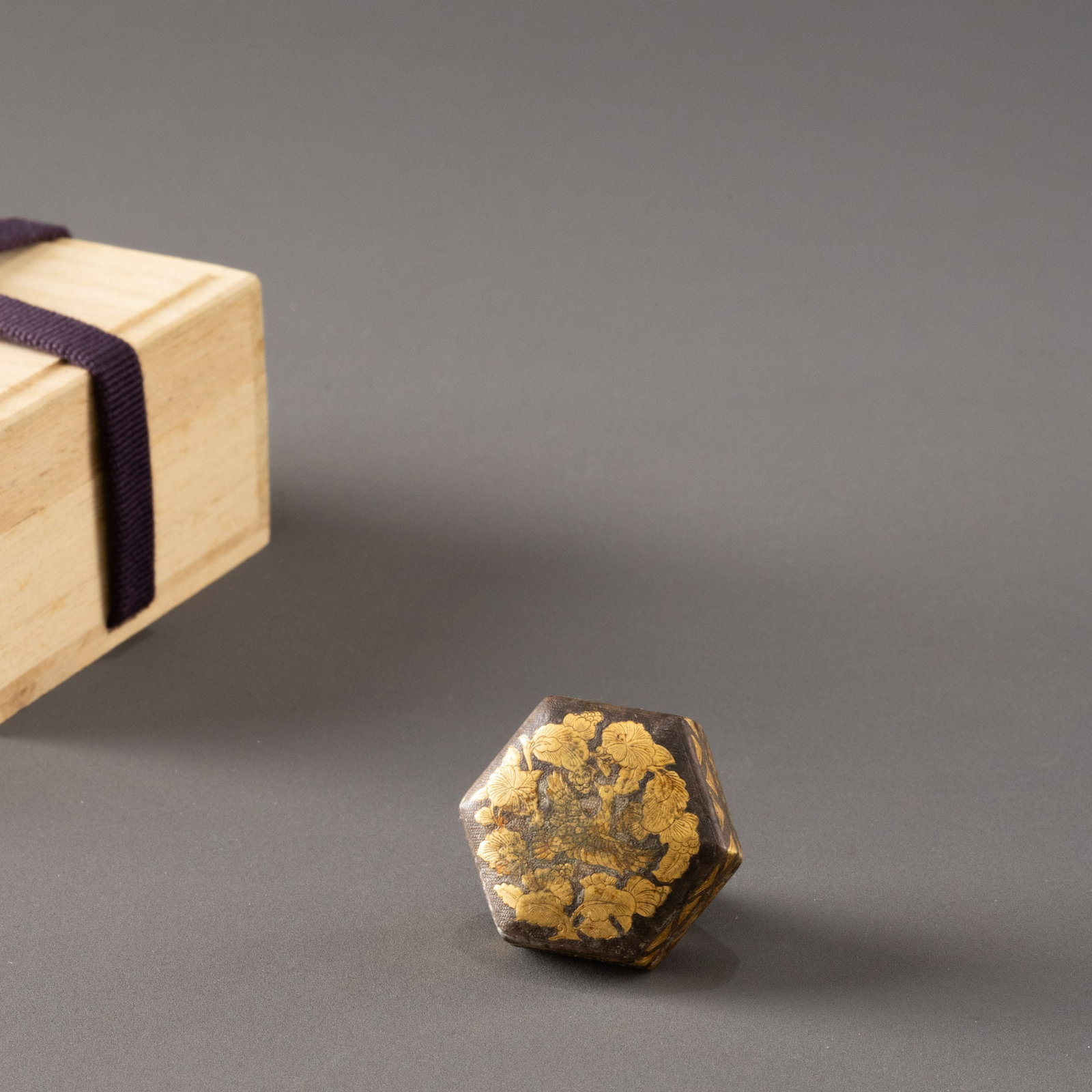 Hexagonal gilt bronze box with peony design: W: 3.3cm H: 1.3cm