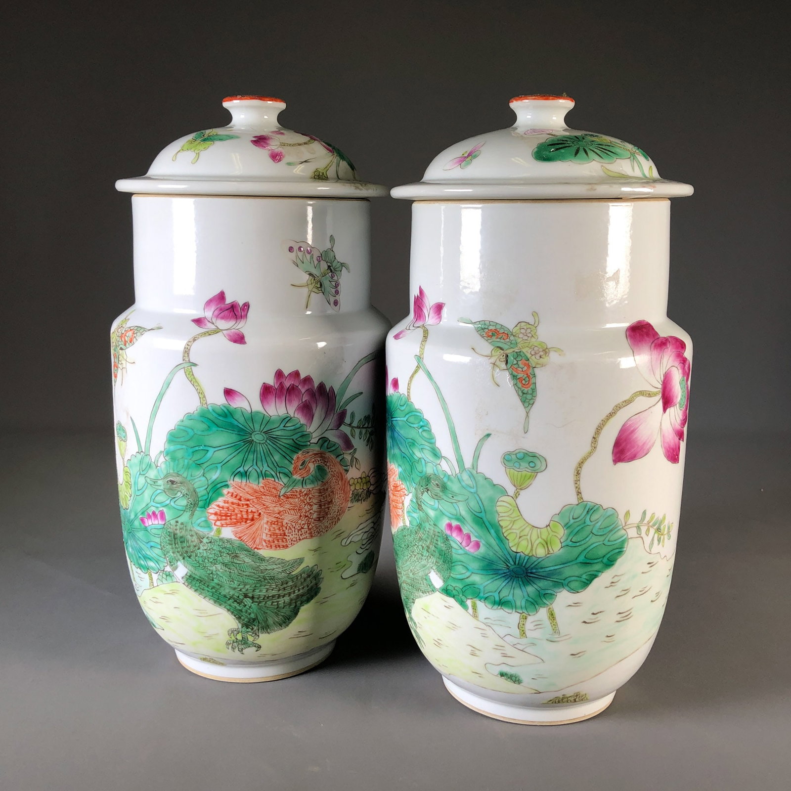 A pair of famille rose lotus and mandarin duck covered jars with Tongzhi reign mark from the 1950s (1 of 9)