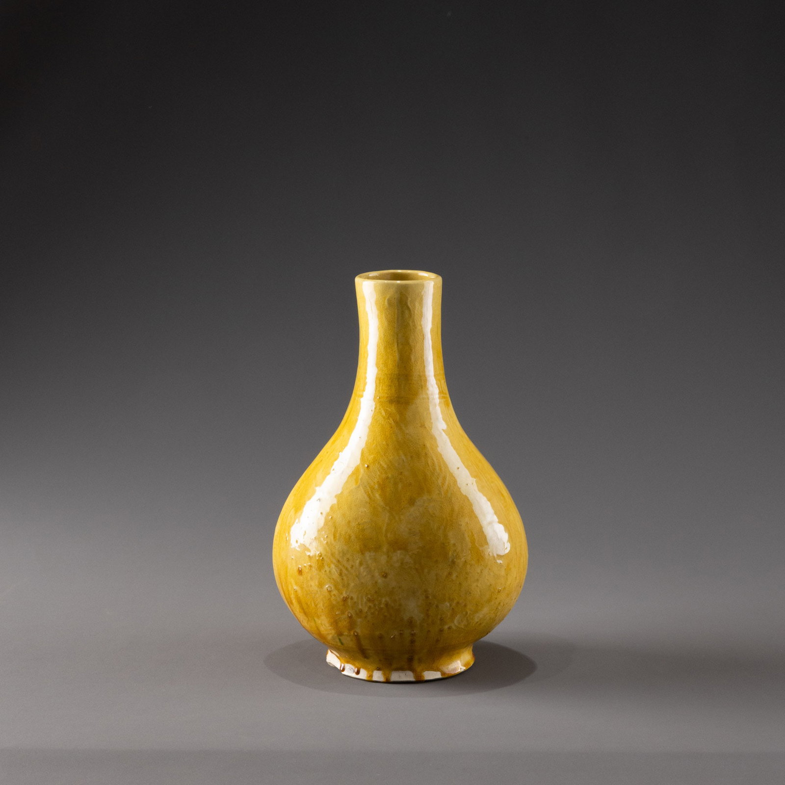 Qing Dynasty yellow-glazed bottle with incised design (1 of 9)