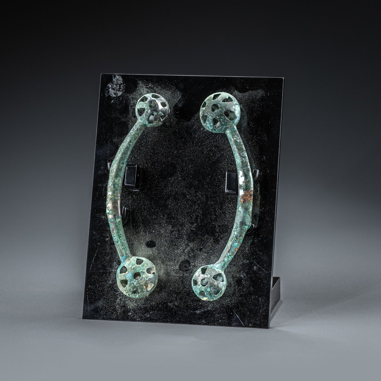 A pair of Han Dynasty Ordos bronze double-headed bells: L: 16cm x 2