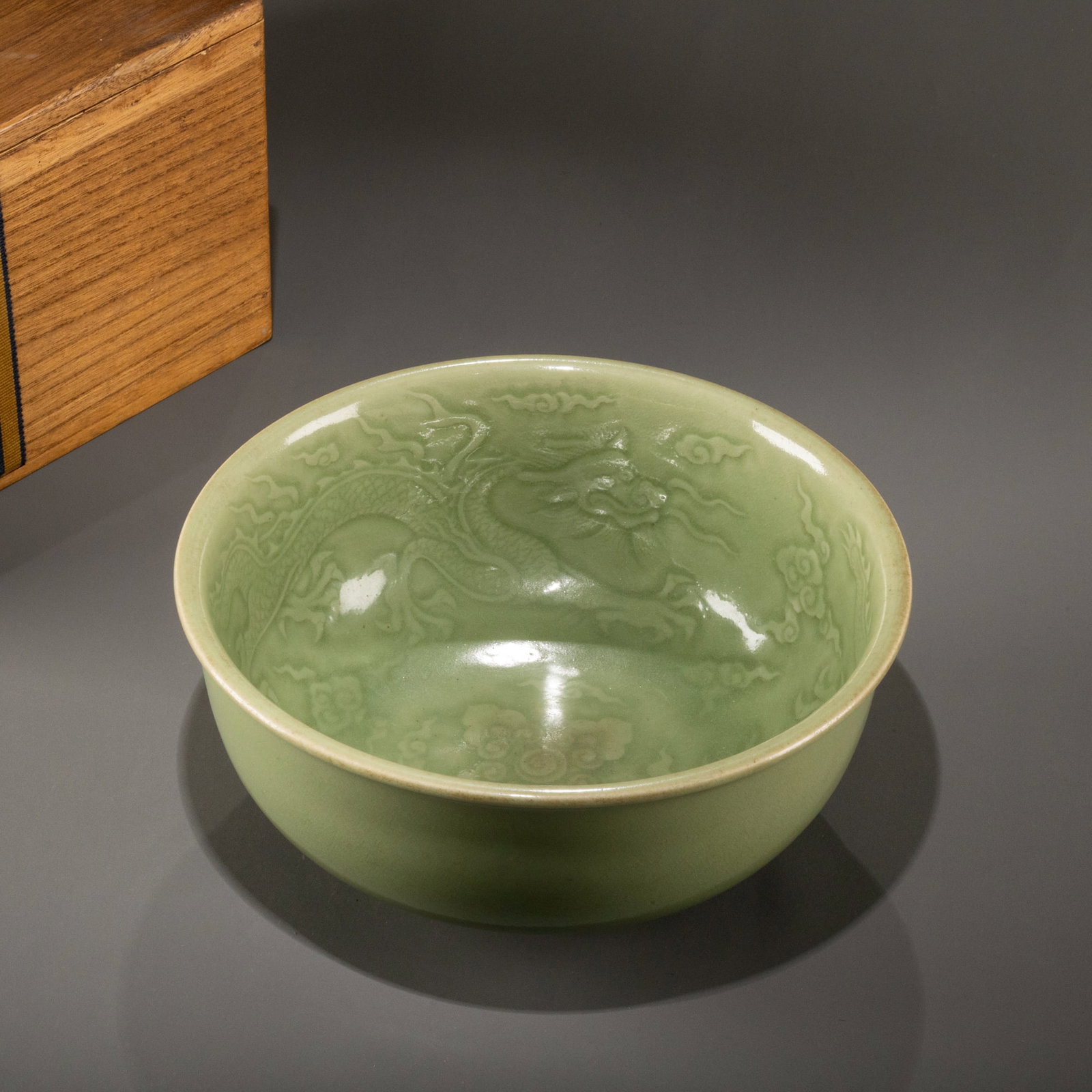 Ming Dynasty Longquan ware celadon bowl with carved dragon design: D: 24cm H: 11.5cm