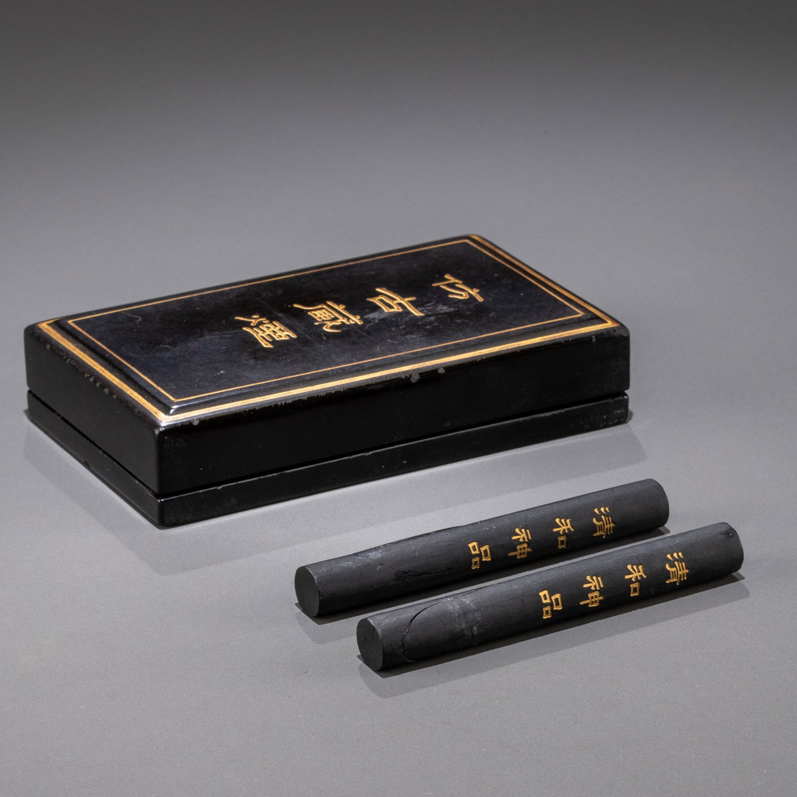 A box of Qinghe Shenpin ink from the Qianlong period of the Qing Dynasty, containing two ink sticks.: H: 9.5cm W: 1cm x 2