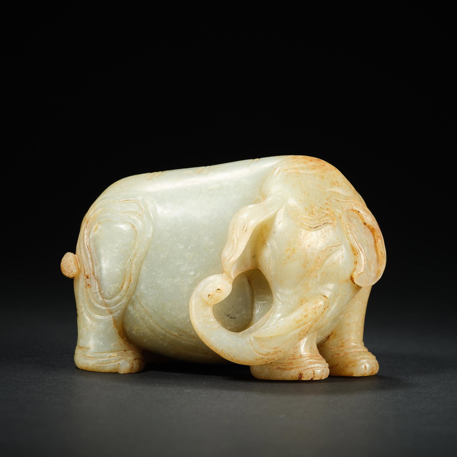 HETIAN Jade Elephant in Tang Dynasty of China: H. 6 cm.W. 9 cm.Weight. 336.5 gram.