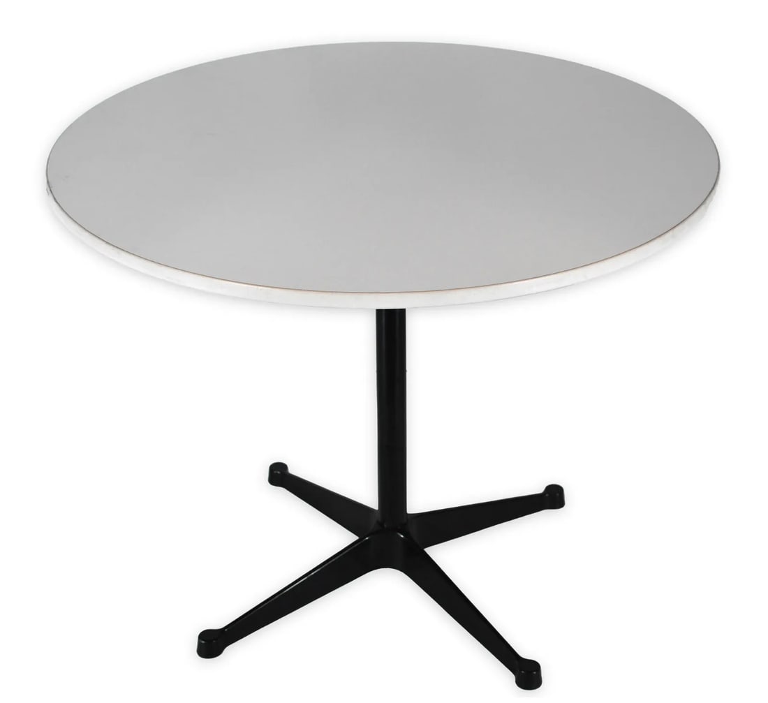 Herman Miller Round Table on Vintage Eames Aluminum Group Black Table Base: Vintage Herman Miller table designed by Charles Eames. Features white table top on black aluminum group table base. Herman Miller medallion located on underside of table. Measures 36" in diameter and