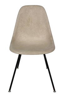 Charles Eames Herman Miller Early Tan Fiberglass Side Chair Vintage: Herman Miller fiberglass side chair on black legs. Tan in color. Original gliders still intact. Herman Miller marking on base. Approx. dimensions are 31" x 18.5" x 23"