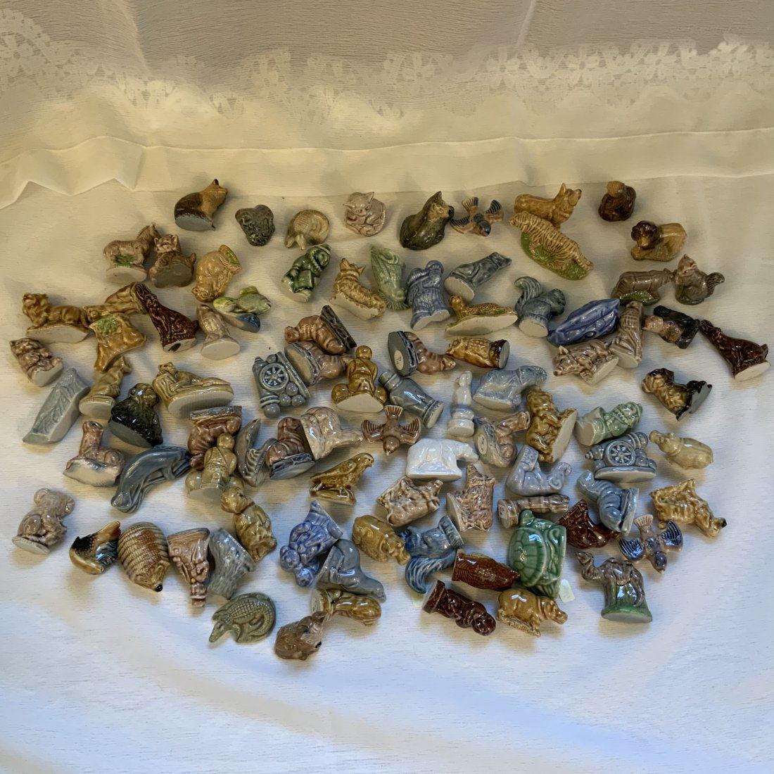 Huge Lot Of Wade Whimsies 89 Pieces: An 89 piece lot of Wade.Whimsies made by George Wade & Sons Ltd, Burslem, England It includes a broad variety of Wade figurines, some in duplicate. Some of the animal included are lions, rabbits, dogs
