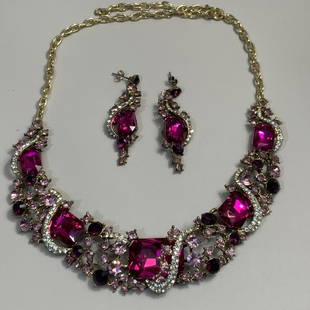 VINTAGE NECKLACE AND EARRING SET: Vintage elegant necklace and post earring set. Gold tone with magenta, deep purple, and lavender stones. Necklace is 18 inches long, earrings are 2 inches long.